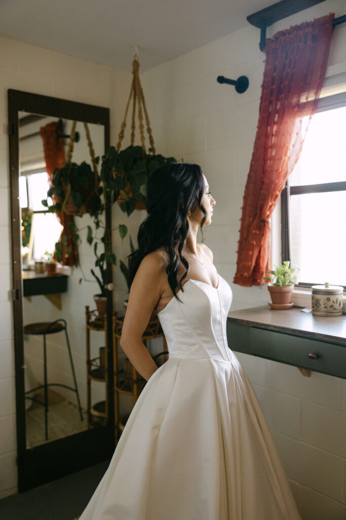 A bride getting ready in the wedding suite at Rockledge Gardens