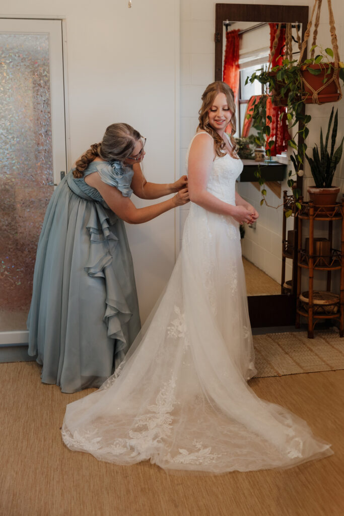 A bride getting ready in the wedding suite at Rockledge Gardens