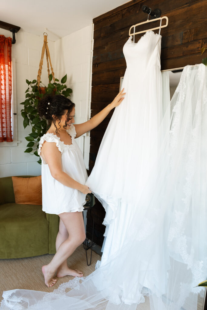 A bride getting ready in the wedding suite at Rockledge Gardens